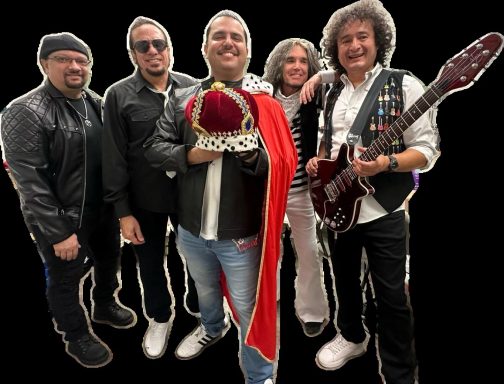 Five musicians posing together, one holding a crown and wearing a red cape.